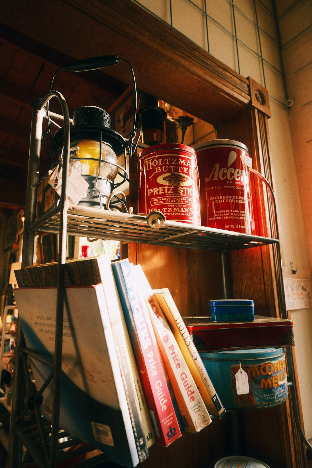 Stack of old hardcover books on a wooden shelf